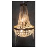 Vintage brass chandelier with glass prisms