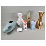 Group of ceramic vases, candleholder, and bell