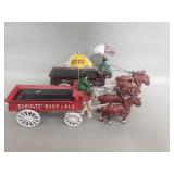 Pair of cast iron horse drawn wagons