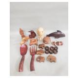 Group of carved wood figurines, napkin rings, bowl