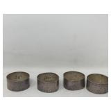 Set of four sterling silver napkin rings