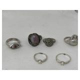 Group of six silver scratch tested rings