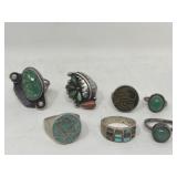 Group of seven silver scratch tested rings