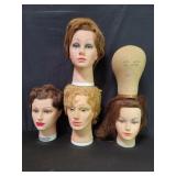 Four vintage rubber cosmetology training heads