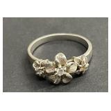 Sterling signed three sculpted plumeria  ring