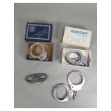 Group of vintage handcuffs and thumb cuffs