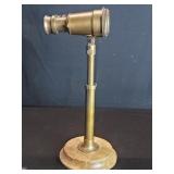 Brass decorative binoculars on wood stand