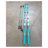 Vintage green Rossignol slalom skis with ski