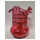 Vintage cranberry glass with a ruffled rim