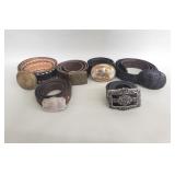 Group of leather belts with brass and silver