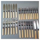 Group of flatware with sterling silver band