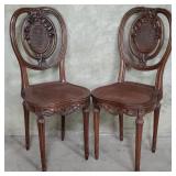 Pair of vintage carved walnut caned chairs