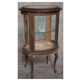 Antique French curio cabinet with brass accents