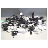 Group of cords, leads, chargers, batteries,