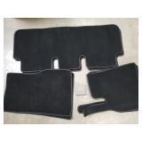 2 sets of Tesla floor mats and a box of coat hooks