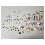 Group of vintage tie clips, collar pins, and