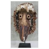 African carved guere mask on metal stand