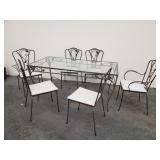 Wrought iron patio dining set with a glass top