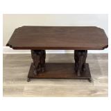 Vintage wood coffee table with carved elephant