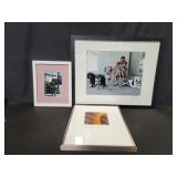 Three framed photographs
