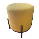 Vintage upholstered footstool with metal base