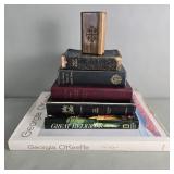 Group of religions books and a Georgia O'keeffe