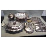 Group of silver plate serving trays and lids