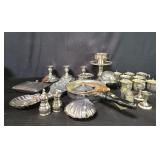 Group of silver plate candlesticks, cups, bowls,