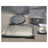 Group of vintage mirrored trays, desk clock, and