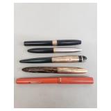 Vintage fountain pens with 14k gold nibs, one