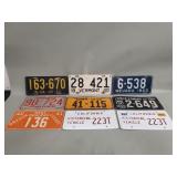 Nine vintage license plates