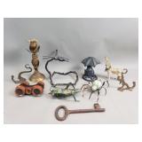 Group of metal figurines, candlestick, wall