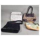 Group of coach handbags