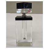 Art Deco-style acrylic perfume bottle with black