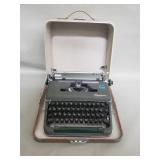 Vintage Olympia portable typewriter with hard case