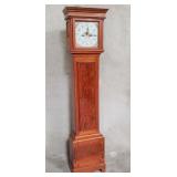 Antique mahogany grandfather clock with hand