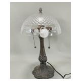 Vintage cast metal table lamp with a clear e