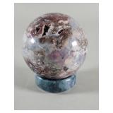 Polished chalcedony agate crystal sphere with a