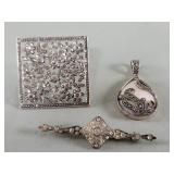 Three sterling silver, marcasite and rhinestones