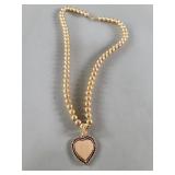 14k gold beaded necklace with 14k gold and ruby