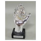 Sterling silver clad hand holding Jerusalem