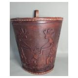 Brown leather waste basket depicting embossed