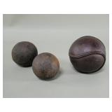 Vintage baseball, softball and iron canon ball
