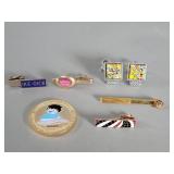 Tie clips, cufflinks, commemorative coin.