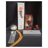 Barbie doll, boomerang, brass tone stack of