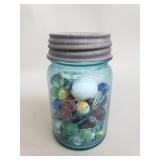 Vintage marbles in a glass jar
