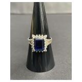 Sterling silver ring with emerald-cut blue and