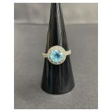 Sterling silver ring with blue topaz and clear