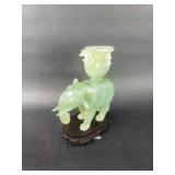 Carved green elephant sculpture