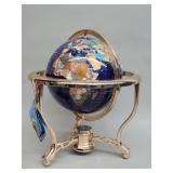 Gemstone globe featuring a blue lapis ocean and
